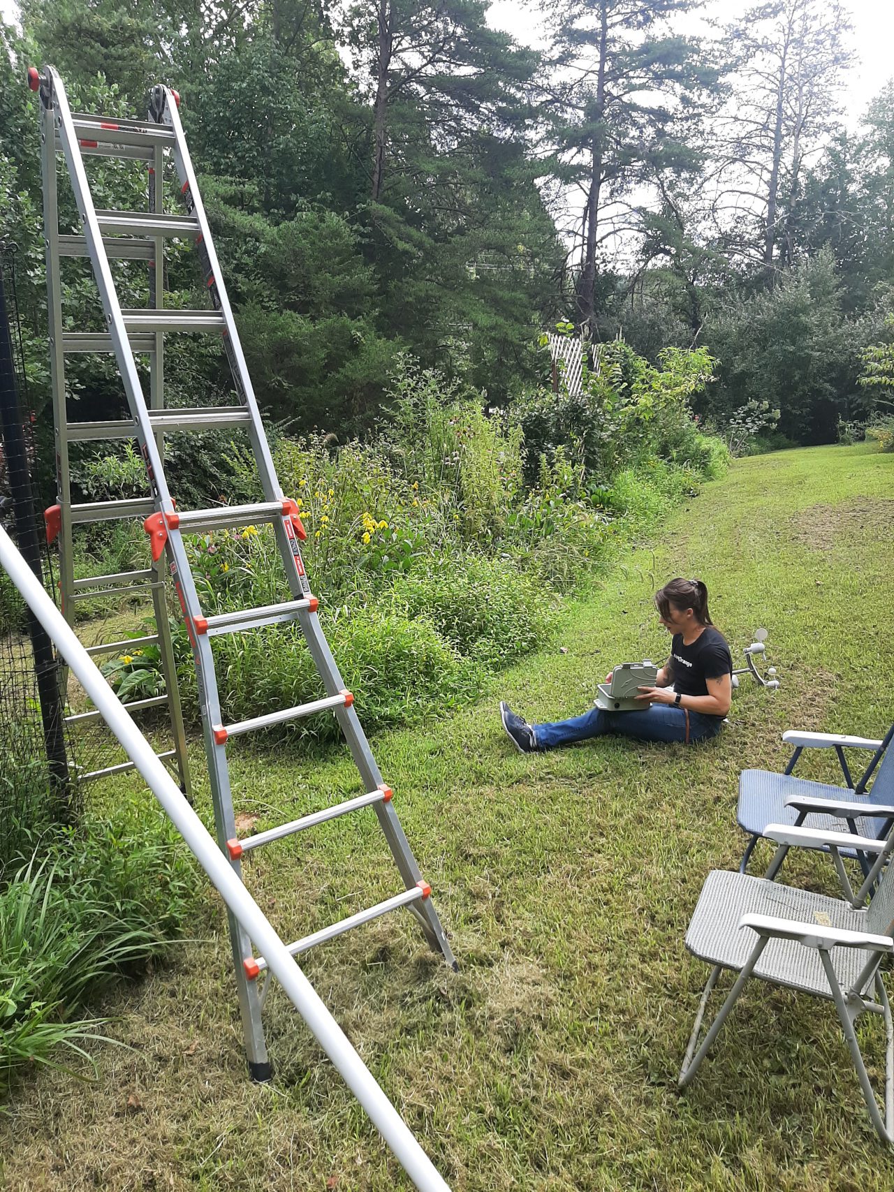 The author finishing up the cable plate assembly in the field (literally).